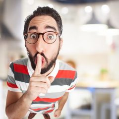 crazy young man silence gesture
