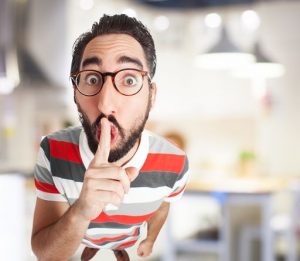 crazy young man silence gesture