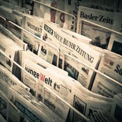 Newspaper rack with papers from many countries